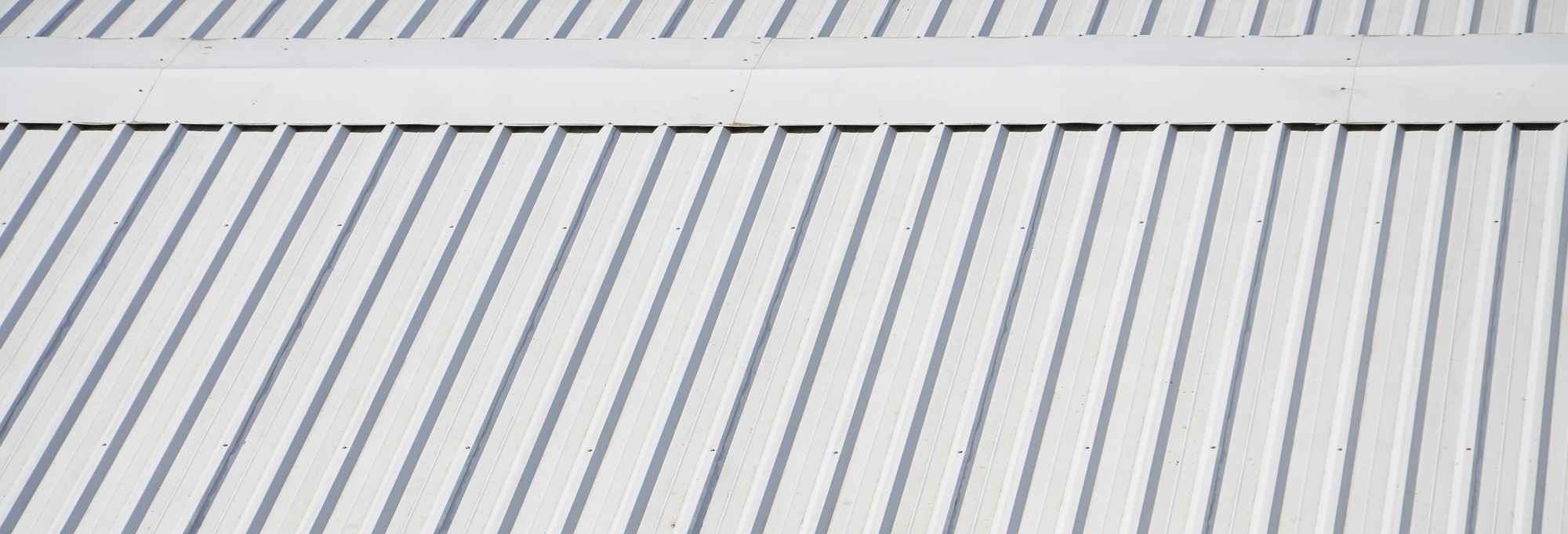 Metal gray roof with rhythmic parallel relief directions